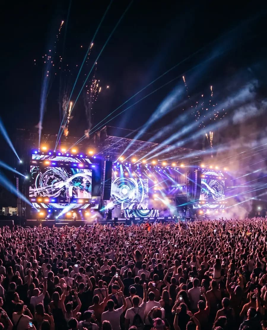 Concert crowd under stage lights in Dubai — event and festival marketing